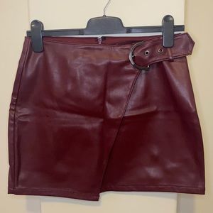 Burgundy leather mini skirt with buckle detail